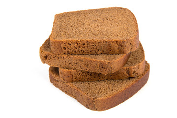 Sliced black rye bread on white background