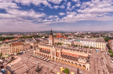 Fototapeta premium Main market square, cloth hall and town hall tower seen from above, Krakow, Poland