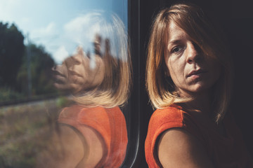 A woman in train alone and sad