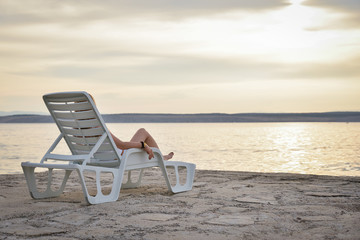 Fototapeta na wymiar Relax on sunbeds on peaceful beach, holiday and vacation