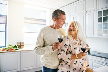 Vivacious healthy elderly couple drinking wine