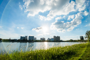 Lake in city park with skyline in background