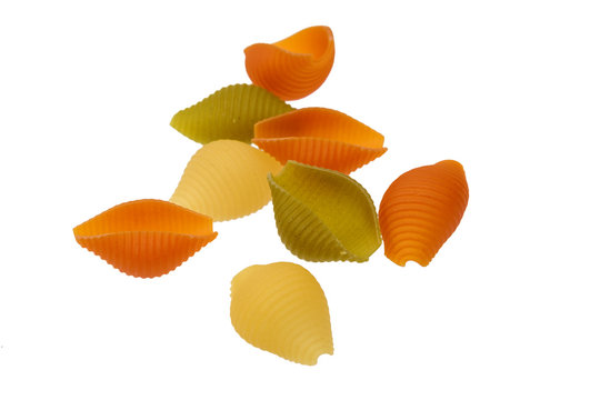 Raw colored pasta isolated on white background