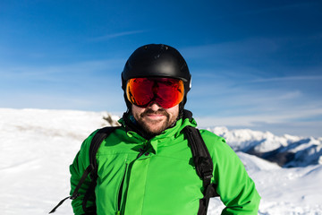 Happy skier with large oversized ski goggles