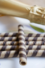 rolled wafers and champagne bottle