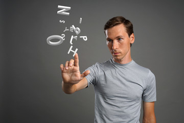 Man working with a set of letters, writing concept.