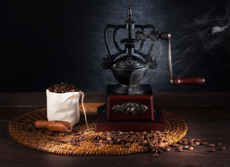 Still life vintage coffee grinder and coffee beans