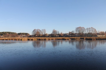 autumn landscape. the lake in the village