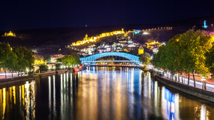Tbilisi downtown. peace bridge made from glass, river Mtkvari, a