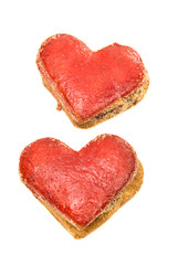 Naklejka na ściany i meble Cookies hearts in red icing isolated