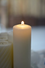 a lighted white candle