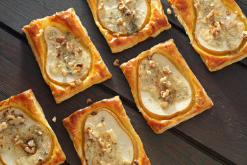 Pears baked in puff pastry with gorgonzola cheese and walnuts