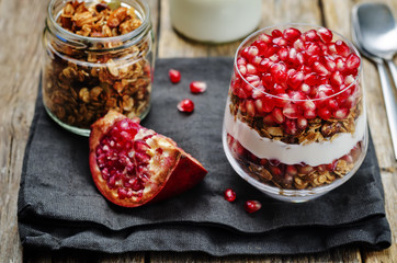 Greek yogurt granola Pomegranate parfait. toning. selective focus