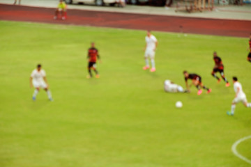 Obraz na płótnie Canvas Football / Blur of football players running on the field during match.