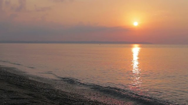 Mediterranean coastline, deserted beach sea at sunset