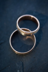 Obraz na płótnie Canvas Wedding day details - two lovely golden wedding rings 