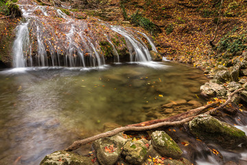 Fototapeta premium Beautiful river and waterfall in the autumn forest