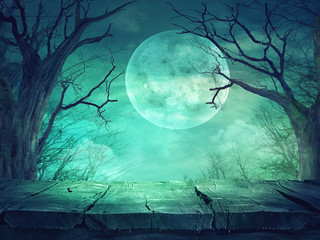 Spooky forest with full moon and wooden table - 121044675