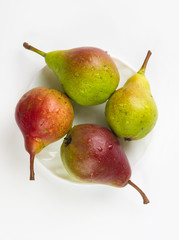 colorful pears in the dish