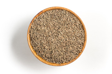 Fototapeta na wymiar Cumin seeds into a bowl