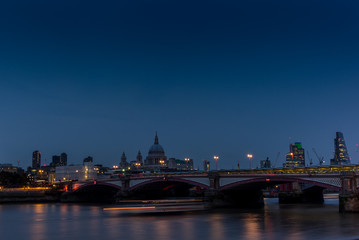 Night falling on St. Paul's cathedral and the Blackfriars bridge