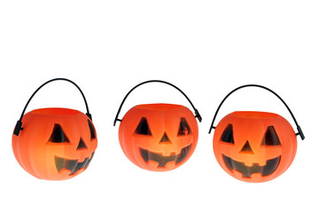 Pumpkin head / Plastic toy pumpkin head on white background.