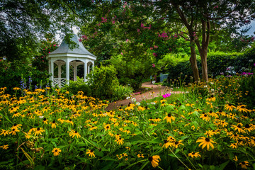 Colorful garden and gazebo in a park in Alexandria, Virginia.