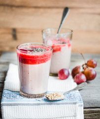 oatmeal pudding with strawberry sauce and grapes, tinting