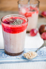 oatmeal pudding with strawberry sauce and grapes, rustic