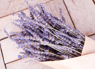 Bunch of dried lavender on a wooden background