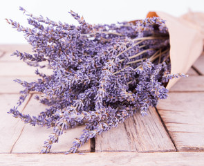Bunch of dried lavender on a wooden background