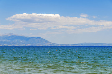 Sea background close with cloudy sky