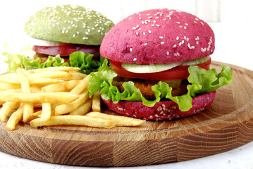 Different colors of burgers and fries