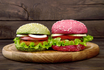 Different colours of burgers and fries