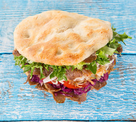 close up of kebab sandwich.