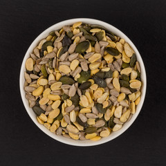 mixed seeds in wooden bowl
