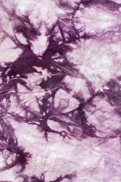 Seamless picture of tie dyed purple fabric