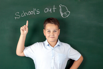 boy in a shirt with school boards