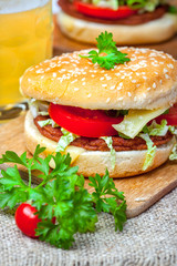 Homemade hamburger with fresh vegetables.