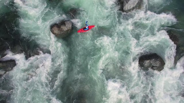 Overhead Aerial Shot of Man in Kayak on Raging River with Rapids