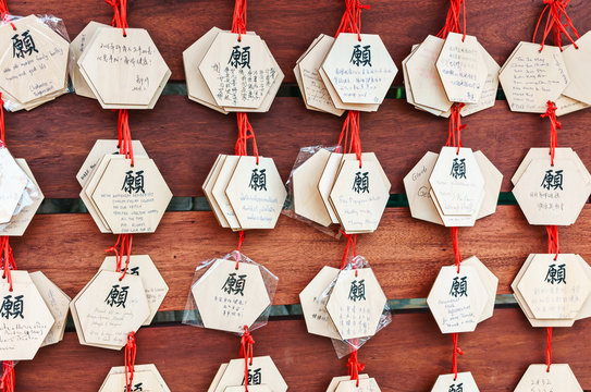 Buddhist wish cards hanging on the wooden board in Ngong Ping village, Lantau Island, Hong Kong