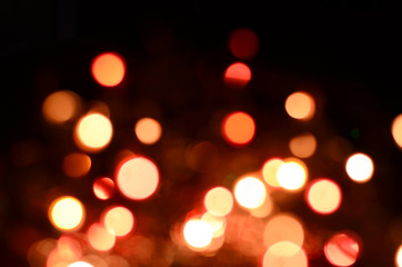 Bright christmas eve background. Plenty of golden sparkling bokeh from defocused garland lights.