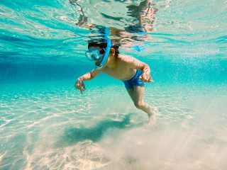 Boy swimming underwater