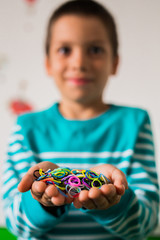  Happy kid holding loom bands