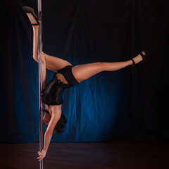 studio photo on a pole dancer