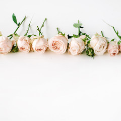 Obraz na płótnie Canvas Roses on white background. Flat lay, top view