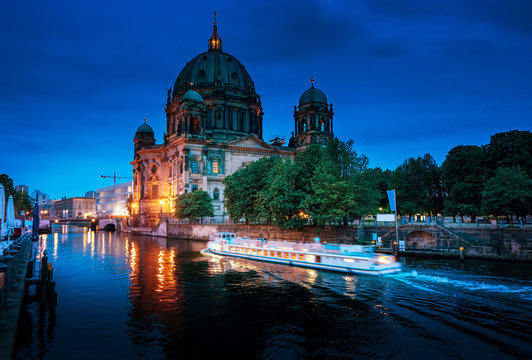 Berlin Cathedral with excursion boat on Spree river, Berlin, Ger