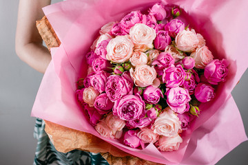 Luxury bouquets of flowers Pink Colour peonies and roses in the hands women.