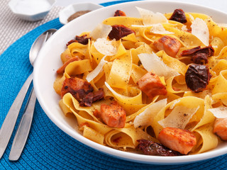 Italian Fettuccine pasta with salmon, parmesan and dried tomatoe