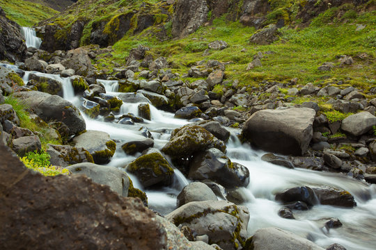 Waterfall. Water running over rocks. Iceland.